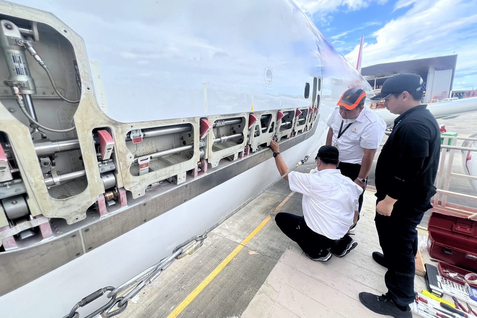 Engineers carrying out a cargo door check on the ramp