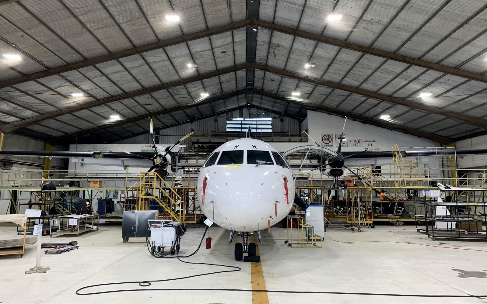 Turboprop aircraft in the hangar undergoing a maintenance check